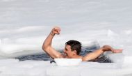Czech free-diver David Vencl reacts after breaking the new world record in under-ice swimming in a lake at a former quarry in the village of Lahost near the city of Teplice, Czech Republic, February 23, 2021.  REUTERS/David W Cerny