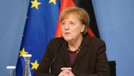 German Chancellor Angela Merkel receives the 2021 report by the Council of Experts on Research and Innovation (EFI), in Berlin, Germany February 24, 2021. Sean Gallup/Pool via REUTERS
