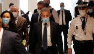 Former French President Nicolas Sarkozy, wearing a protective face mask, arrives for the verdict in his trial on charges of corruption and influence peddling, at Paris courthouse, France, March 1, 2021. REUTERS/Gonzalo Fuentes