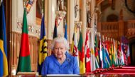 Britain's Queen Elizabeth II signs her annual commonwealth Day message in St George's Hall at Windsor Castle, Britain, in this picture issued March 5, 2021. Steve Parsons/Pool via REUTERS
