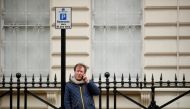 Richard Ratcliffe, husband of British-Iranian aid worker Nazanin Zaghari-Ratcliffe, talks on a mobile phone outside the Iranian Embassy in London, Britain March 8, 2021. REUTERS/Andrew Boyers