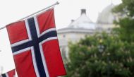 FILE PHOTO: Norwegian flags flutter at Karl Johans street in Oslo, Norway, May 31, 2017. REUTERS/Ints Kalnins//File Photo
