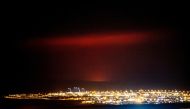 A volcanic eruption is seen (rear) near Fagradalsfjall, a mountain on the Reykjanes Peninsula, Iceland March 19, 2021, in this picture obtained from social media. Picture taken March 19, 2021. Mandatory credit VF.IS/via REUTERS.