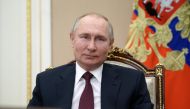 Russian President Vladimir Putin takes part in a meeting with community representatives and residents of Crimea and Sevastopol via a video link in Moscow, Russia March 18, 2021. Sputnik/Alexei Druzhinin/Kremlin via REUTERS