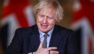 Britain's Prime Minister BORis Johnson gestures as he holds a news conference at 10 Downing Street, on the day of reflection to mark the anniversary of Britain's first coronavirus disease (COVID-19) lockdown, in London, Britain March 23, 2021. REUTERS/Han