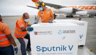 Workers take care of the shipment of Russia's Sputnik V vaccine against the coronavirus disease (COVID-19) at the airport, in Caracas, Venezuela March 29, 2021. REUTERS/Manaure Quintero