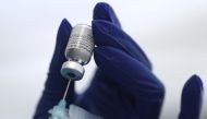 Filephoto: A healthcare worker prepares a Pfizer coronavirus disease (COVID-19) vaccination in Los Angeles, California, U.S., January 7, 2021. REUTERS/Lucy Nicholson/File Photo