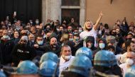 People face police as restaurant owners demonstrate as tensions rise over COVID-19 restrictions on businesses, in Rome, Italy April 6, 2021. REUTERS/Yara Nardi
