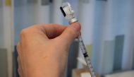 Training nurse Sari Roos prepares a dose of Pfizer/BioNTech vaccine against coronavirus disease (COVID-19) to teach her air bubble technique in Laakso hospital in Helsinki, Finland March 11, 2021. Picture taken March 11, 2021. Reuters/Essi Lehto