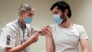 A volunteer receives a dose of CureVac vaccine or a placebo during a study by the German biotech firm CureVac as part of a testing for a new vaccine against the coronavirus disease (COVID-19), in Brussels, Belgium March 2, 2021. REUTERS/Yves Herman/File P