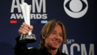 54th Academy of Country Music Awards - Photo Room- Las Vegas, Nevada, U.S., April 7, 2019 - Keith Urban poses backstage with his Entertainer of the Year award. REUTERS/Steve Marcus/File Photo