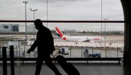 A man walks inside a Terminal at Paris Charles de Gaulle airport in Roissy near Paris as France closed its borders to travellers outside European Union due to restrictions against the spread of the coronavirus disease (COVID-19) in France, February 5, 202