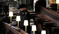 Britain's Queen Elizabeth is seen during the funeral of Britain's Prince Philip, husband of Queen Elizabeth, who died at the age of 99, at St George's Chapel, in Windsor, Britain, April 17, 2021. Yui Mok/Pool via REUTERS/File Photo