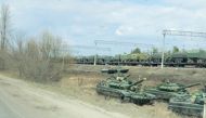 FILE PHOTO: A still image from video shows tanks and military vehicles in Maslovka, Voronezh Region, Russia April 6, 2021. 