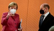 File photo: German Chancellor Angela Merkel and Finance Minister and Vice-Chancellor Olaf Scholz arrive for the weekly cabinet meeting at the Chancellery in Berlin, Germany April 21, 2021. Tobias Schwarz/Pool via Reuters/File Photo