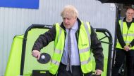 Britain's Prime Minister Boris Johnson plays table tennis during his visit at Net World Sports in Wrexham, Wales, Britain April 26, 2021. Rob Formstone/Pool via Reuters