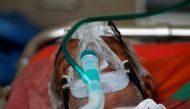 A patient wearing an oxygen mask is seen inside an ambulance waiting to enter a COVID-19 hospital for treatment, amidst the spread of the coronavirus disease (COVID-19) in Ahmedabad, India, April 25, 2021. REUTERS/Amit Dave/File Photo