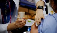 FILE PHOTO: A health worker gets a dose of the Pfizer-BioNTech coronavirus disease (COVID-19) vaccine at a COVID-19 vaccination center in Seoul, South Korea, March 10, 2021. REUTERS/Kim Hong-Ji/File Photo/File Photo
