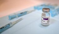 Needles and a vial of AstraZeneca's vaccine against coronavirus disease (COVID-19) are pictured during a pilot test which aims to apply 20,000 vaccines per day in coming months, at Fira de Montjuic in Barcelona, Spain, April 26, 2021. REUTERS/Nacho Doce