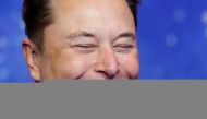 File photo: SpaceX owner and Tesla CEO Elon Musk laughs after arriving on the red carpet for the Axel Springer award, in Berlin, Germany, December 1, 2020. Reuters/Hannibal Hanschke/Pool/File Photo