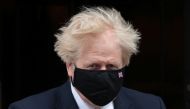 Britain's Prime Minister Boris Johnson walks outside Downing Street in London, Britain, May 12, 2021. (Reuters/Hannah McKay)