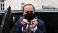 Britain's Health Secretary Matt Hancock adjusts his protective mask as he leaves BBC Broadcasting House in London, Britain, May 16,2021. Reuters/Tom Nicholson
