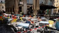Chairs and tables line up in front of a cafe during preparations for the reopening of restaurants as part of an easing of the country's lockdown restrictions amid the coronavirus disease (COVID-19) outbreak in Vienna, Austria May 18, 2021. Reuters/Leonhar