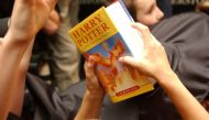 FILE PHOTO: A child holds a copy of 