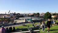 People enjoy the sunny weather on the first day that tourists from Britain and most EU countries are allowed to enter Portugal without needing to quarantine, as coronavirus disease (COVID-19) restrictions continue to ease, in Vila Nova de Gaia, Portugal M