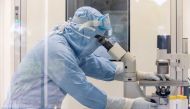 File photo: A researcher works inside a laboratory during the development of the Italian ReiThera COVID-19 vaccine, in this undated handout photo in Rome, Italy. ReiThera/Handout via Reuters/File Photo