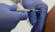 File photo: Professor Gottfried Kremsner injects a vaccination against the coronavirus disease (COVID-19) from German biotechnology company CureVac to a volunteer at the start of a clinical test series at his tropical institute of the university clinic in