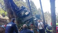 Police and rescue service members are seen near the crashed cable car after it collapsed in Stresa, near Lake Maggiore, Italy May 23, 2021. ITALIAN POLICE/Handout via REUTERS THIS IMAGE HAS BEEN SUPPLIED BY A THIRD PARTY.

