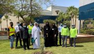 CNA-Q President Dr. Salem Al Naemi planting a tree on campus. 
