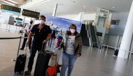 FILE PHOTO: People arrive at Faro Airport from Manchester on the first day that Britons are allowed to enter Portugal without needing to quarantine, as coronavirus disease (COVID-19) restrictions continue to ease, in Faro, Portugal, May 17, 2021. REUTERS/