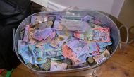 Money seized by Australian Federal Police are seen after its Operation ironside against organised crime in this undated handout photo released June 8, 2021. Australian Federal Police/Handout via REUTERS