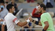 Serbia's Novak Djokovic shakes hands with Spain's Rafael Nadal after winning their semi final match REUTERS/Sarah Meyssonnier