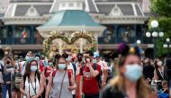 Visitors wear protective face masks at Disneyland Paris as the theme park reopens its doors to the public in Marne-la-Vallee, near Paris, following the coronavirus disease (COVID-19) outbreak in France, June 17, 2021. Reuters/Gonzalo Fuentes