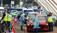 Medical workers administer tests at the Bondi Beach drive-through coronavirus disease (COVID-19) testing centre in the wake of new positive cases in Sydney, Australia, June 17, 2021. REUTERS/Loren Elliott