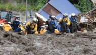 Police officers conduct a rescue and search operation at the site of a mudslide caused by heavy rain at Izusan district in Atami, Japan July 5, 2021.