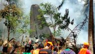 First responders work at the site after a Philippines Air Force Lockheed C-130 plane carrying troops crashed on landing in Patikul, Sulu province, Philippines July 4, 2021. Armed Forces of the Philippines - Joint Task Force Sulu/Handout via REUTERS