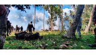 Troops secure the personal belongings of the casualties after the Philippines Air Force Lockheed C-130 plane carrying troops crashed on landing, in Patikul, Sulu province, Philippines July 4, 2021. Picture taken July 4, 2021. Armed Forces of the Philippin