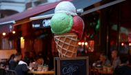 FILE PHOTO: People enjoy the evening at a tarrace at Simon Dach Street, as cafes, and restaurants reopen their terraces after being closed down for months, amid the coronavirus disease (COVID-19) outbreak, in Berlin, Germany, May 21, 2021. REUTERS/Christi