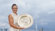 July 11, 2021 Australia's Ashleigh Barty poses with the women's singles trophy on the balcony of the Park Plaza after winning the final Pool via REUTERS/Ben Queenborough