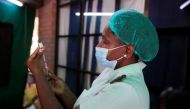 FILE PHOTO: A nurse prepares a dose of the Sinopharm coronavirus disease (COVID-19) vaccine at Wilkins Hospital in Harare, Zimbabwe, March 24, 2021. REUTERS/Philimon Bulawayo/File Photo
