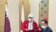 Dr. Thani Al Kuwari (left), President of the Qatar Athletics Federation, presenting a team jersey to the Mayor of Takasaki. Kenji Tomioka during a welcoming ceremony held yesterday.