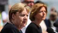 German Chancellor Angela Merkel and Rhineland-Palatinate State Premier Malu Dreyer hold a news conference in the flood-ravaged village of Schuld, near Bad Neuenahr-Ahrweiler, Rhineland-Palatinate state, Germany, July 18, 2021. REUTERS/Wolfgang Rattay