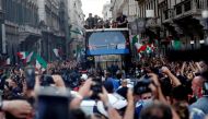 FILE PHOTO: Soccer Football - Euros 2020 - The Italy team drive through Rome on a open top bus tour amidst celebrating fans after winning the Euros 2020, July 12, 2021. REUTERS/Guglielmo Mangiapane/File Photo
