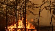 Fire burns in a forest near the village of Magaras in the region of Yakutia, Russia July 17, 2021. Picture taken July 17, 2021. REUTERS/Roman Kutukov
