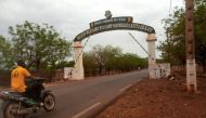 A man rides a motorcycle as he drives past the entrance of the Malian army force base. (Reuters/File Photo)Reuters

