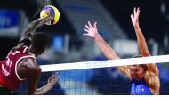 Qatar's Cherif Younousse shoots to score against Italy's Carambula and Rossi during the men's beach volleyball Pool C match played at Shiokaze Park in Tokyo, Japan, yesterday.
